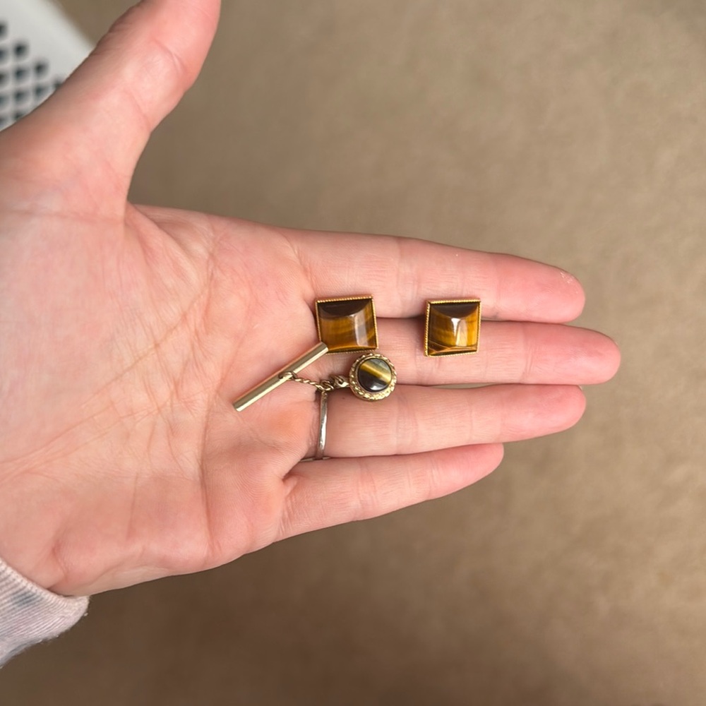 Cats eye and gold cuff links and tie pin